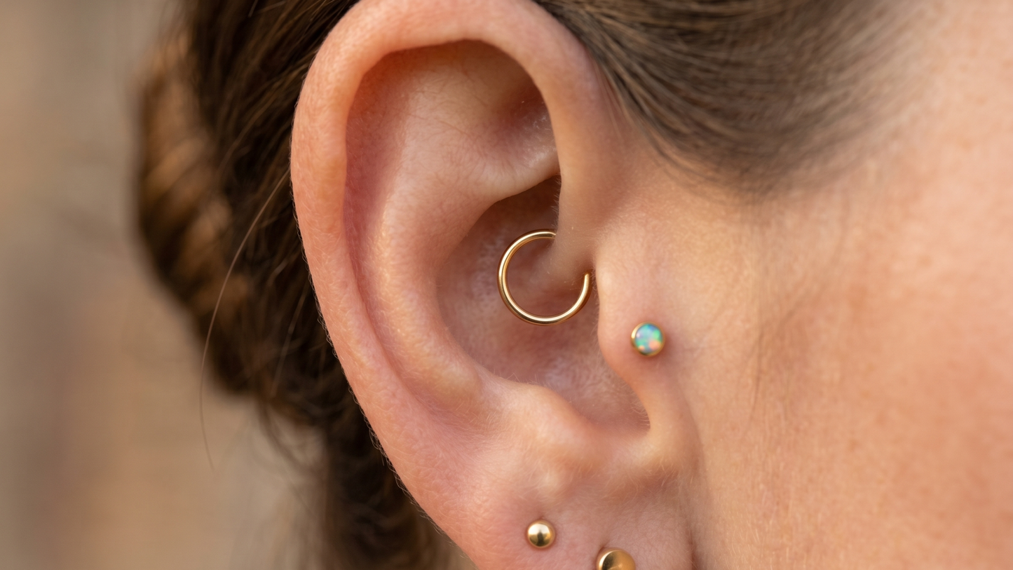 small gold seamless hoop nestled perfectly in the innermost cartilage