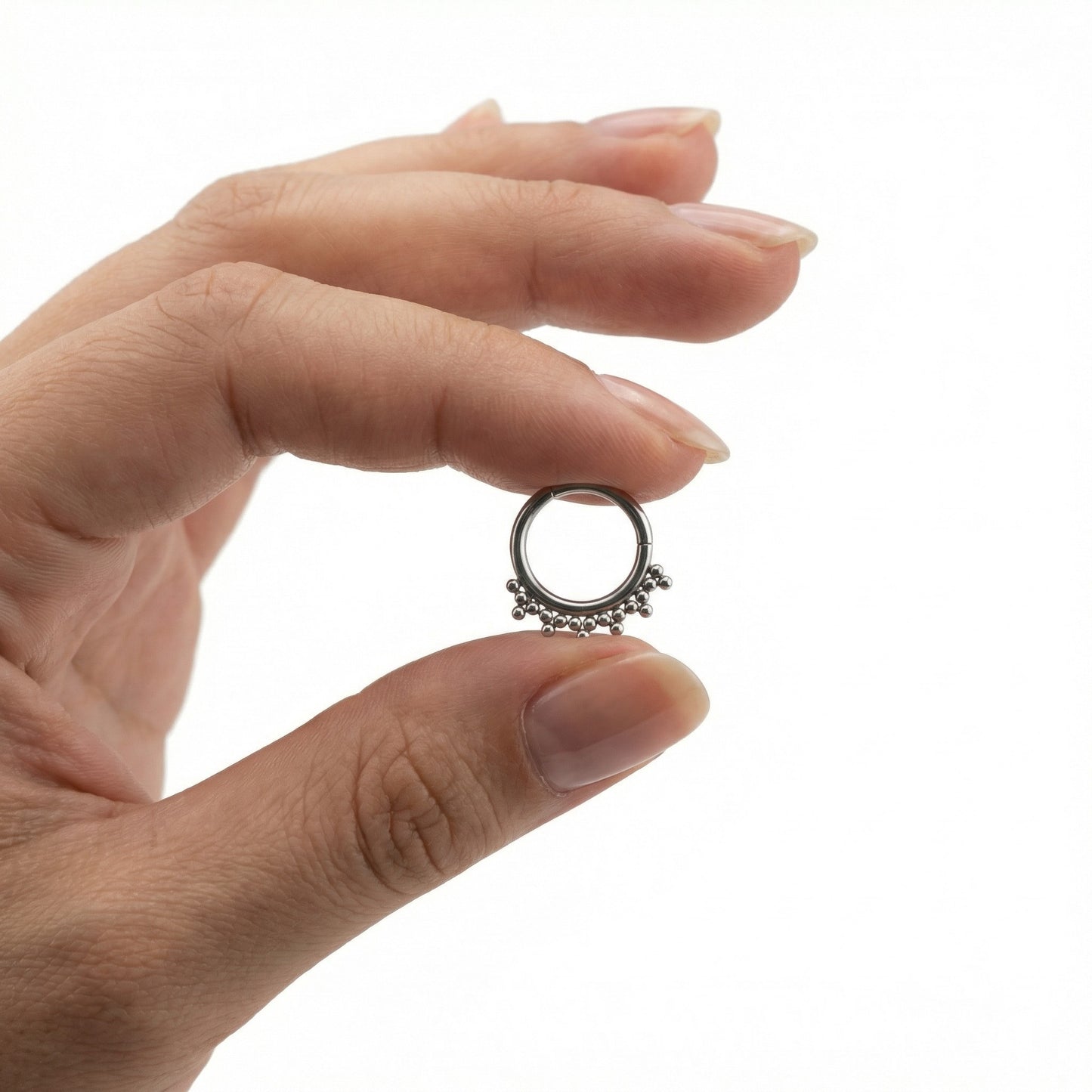 
                  
                    ARGOLA COM TRINITYS EM TITANIO
                  
                