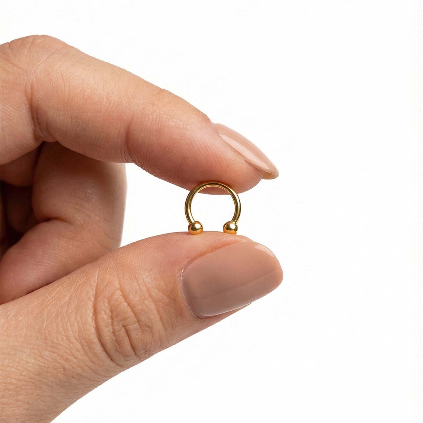 
                  
                    piercing ferradura em dourado
                  
                