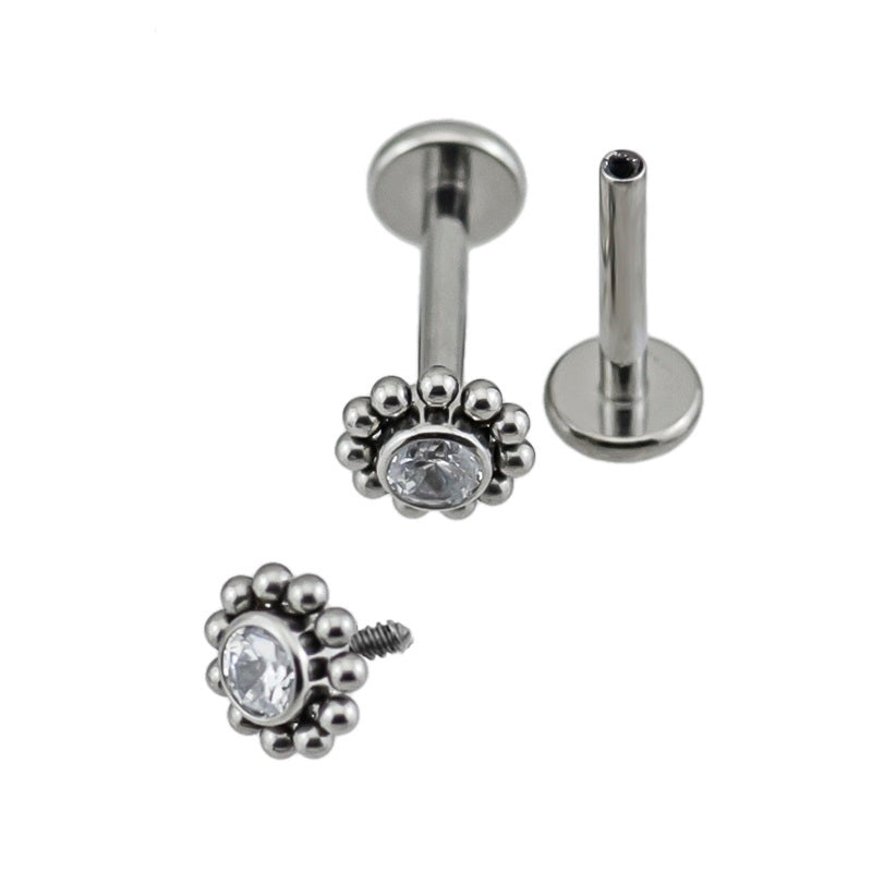 Labret com design floral e zircónia central em Titânio com rosca interna